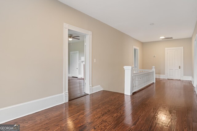 409 N Jefferson Ave, Eatonton, GA 31024 - unfurnished room with wood finished floors, ceiling fan, and baseboards