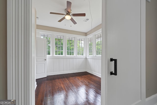 409 N Jefferson Ave, Eatonton, GA 31024 - empty room featuring dark wood finished floors, plenty of natural light, and ceiling fan