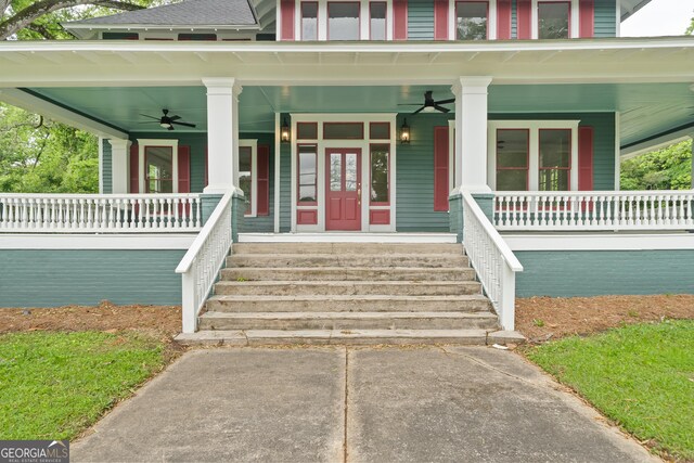 409 N Jefferson Ave, Eatonton, GA 31024 - view of exterior entry featuring a porch and ceiling fan