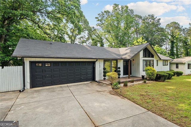 1759 Kimberly Dr, Marietta, GA 30008 - view of front facade featuring concrete driveway, an attached garage, and board and batten siding