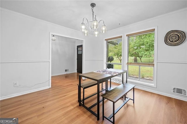 1759 Kimberly Dr, Marietta, GA 30008 - dining room featuring a chandelier, crown molding, light wood-style floors, and baseboards