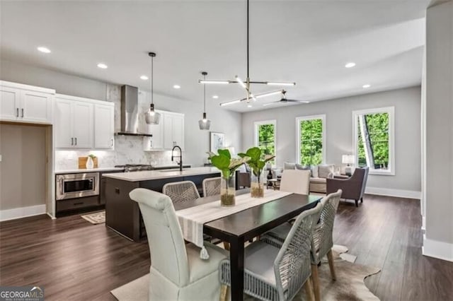 dining area featuring dark wood-style flooring, recessed lighting, and baseboards