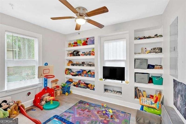 104 Dellwood Dr NW, Rome, GA 30165 - recreation room featuring wood finished floors, ceiling fan, and baseboards