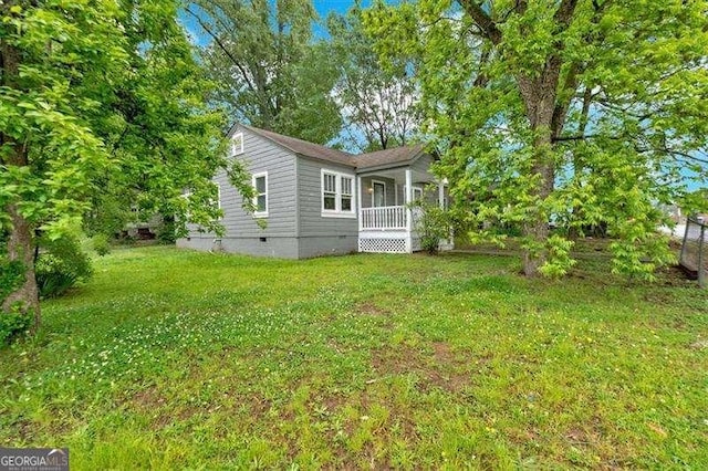 104 Dellwood Dr NW, Rome, GA 30165 - back of property featuring crawl space, a lawn, and covered porch