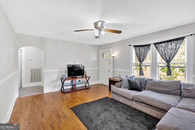 104 Dellwood Dr NW, Rome, GA 30165 - living room with arched walkways, plenty of natural light, and wood finished floors
