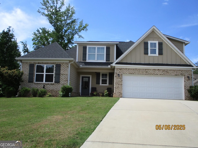 183 Piedmont Lake Dr Unit 152, Gray, GA 31032 - view of front of house with driveway, brick siding, a front yard, board and batten siding, and a shingled roof