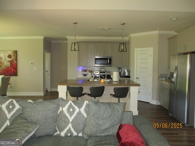 183 Piedmont Lake Dr Unit 152, Gray, GA 31032 - kitchen with appliances with stainless steel finishes, ornamental molding, dark wood finished floors, tasteful backsplash, and baseboards