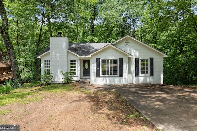 118 Greentree Pkwy, Macon, GA 31220 - ranch-style house featuring a chimney, view of scattered trees, and roof with shingles