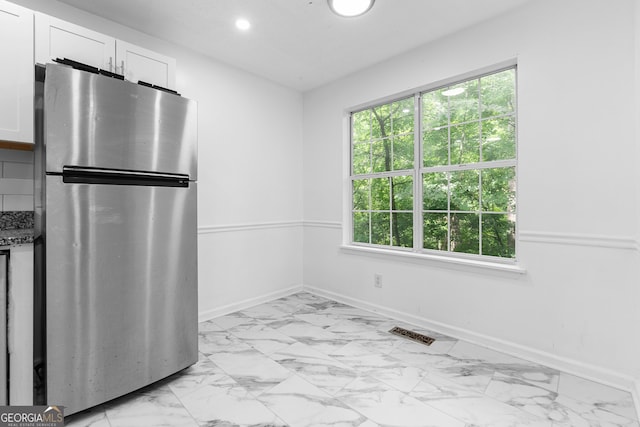 118 Greentree Pkwy, Macon, GA 31220 - kitchen featuring freestanding refrigerator, light marble finish flooring, white cabinets, baseboards, and recessed lighting