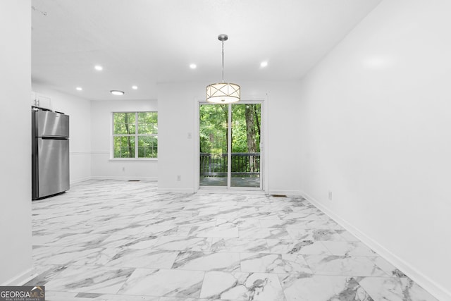 118 Greentree Pkwy, Macon, GA 31220 - unfurnished dining area featuring recessed lighting and light marble finish flooring