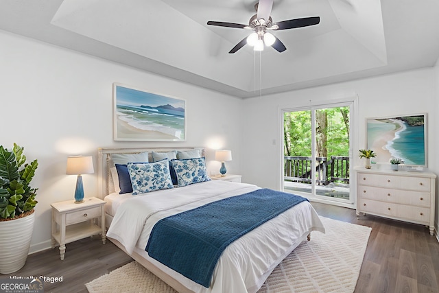 118 Greentree Pkwy, Macon, GA 31220 - bedroom featuring access to outside, a tray ceiling, wood finished floors, and a ceiling fan