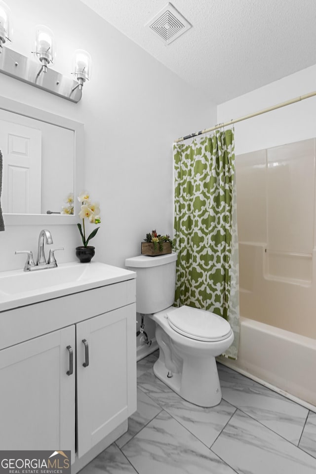 118 Greentree Pkwy, Macon, GA 31220 - full bathroom with vanity, marble look tiles, a textured ceiling, and shower / bath combo with shower curtain