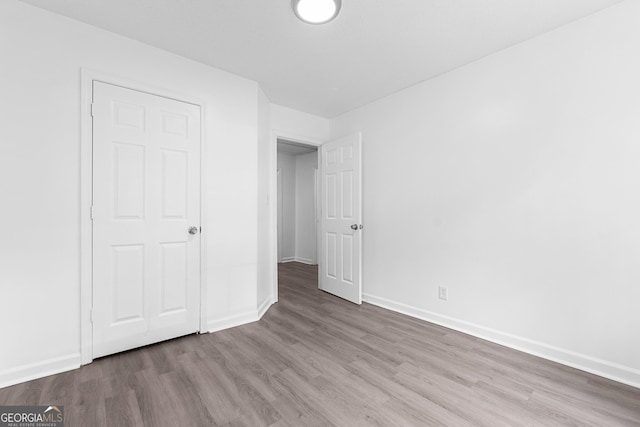 118 Greentree Pkwy, Macon, GA 31220 - unfurnished bedroom with wood finished floors and baseboards