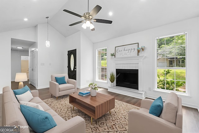 118 Greentree Pkwy, Macon, GA 31220 - living room with wood finished floors, healthy amount of natural light, ceiling fan, a tiled fireplace, and high vaulted ceiling