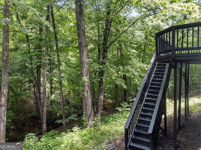 118 Greentree Pkwy, Macon, GA 31220 - view of yard featuring stairway, a wooden deck, and a view of trees