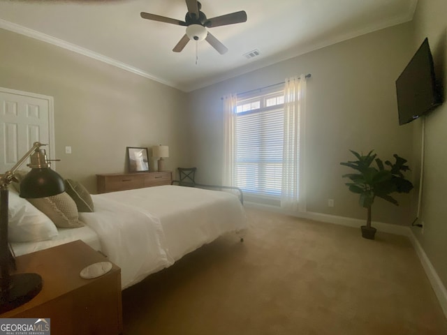 3812 Hartley Bridge Rd, Macon, GA 31216 - carpeted bedroom with ornamental molding, baseboards, and a ceiling fan