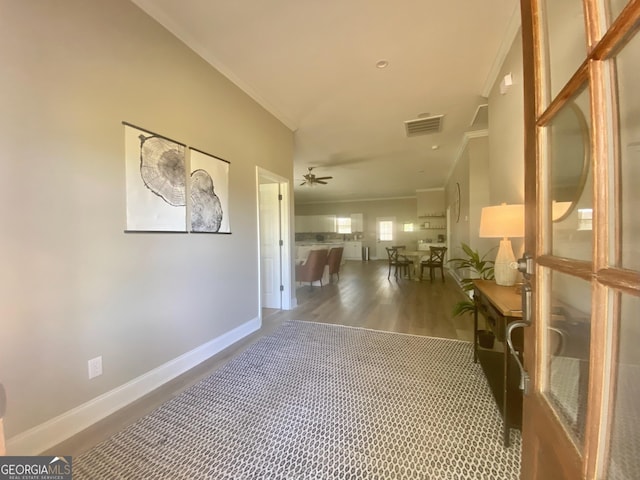 3812 Hartley Bridge Rd, Macon, GA 31216 - hallway featuring crown molding, baseboards, and wood finished floors