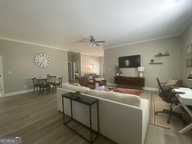 3812 Hartley Bridge Rd, Macon, GA 31216 - living area featuring wood finished floors, crown molding, ceiling fan, and baseboards