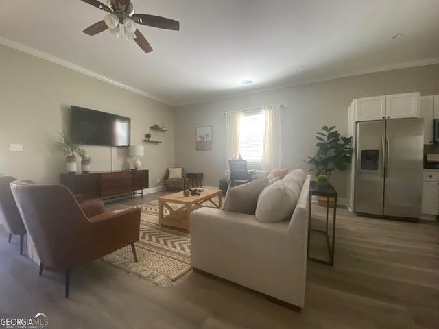3812 Hartley Bridge Rd, Macon, GA 31216 - living area featuring crown molding, wood finished floors, a ceiling fan, and baseboards