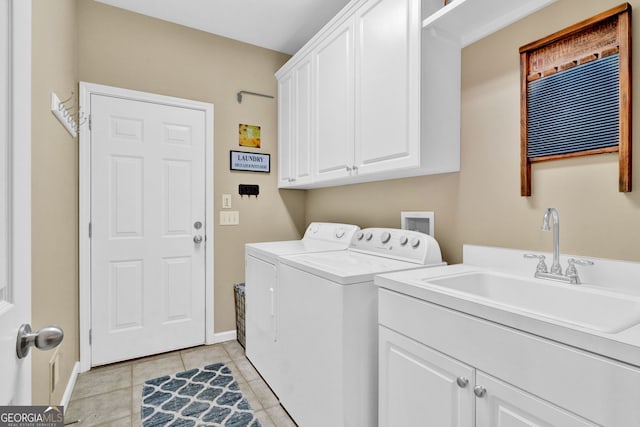 clothes washing area featuring separate washer and dryer, cabinet space, baseboards, and light tile patterned floors