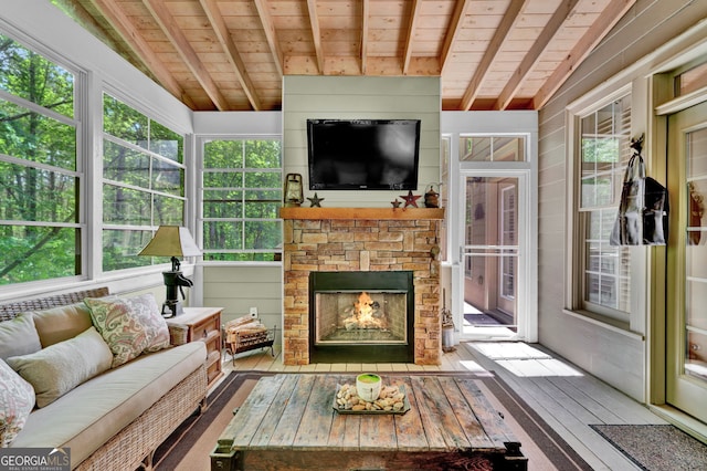 sunroom / solarium with wooden ceiling, wood-type flooring, and healthy amount of natural light