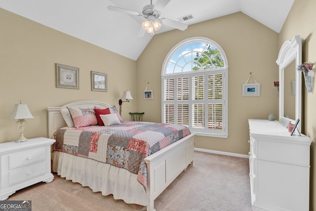 bedroom with light colored carpet, vaulted ceiling, baseboards, and a ceiling fan