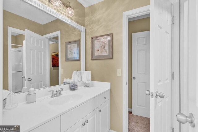bathroom featuring vanity and baseboards