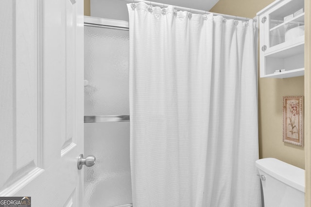 bathroom with toilet and shower / bath combo