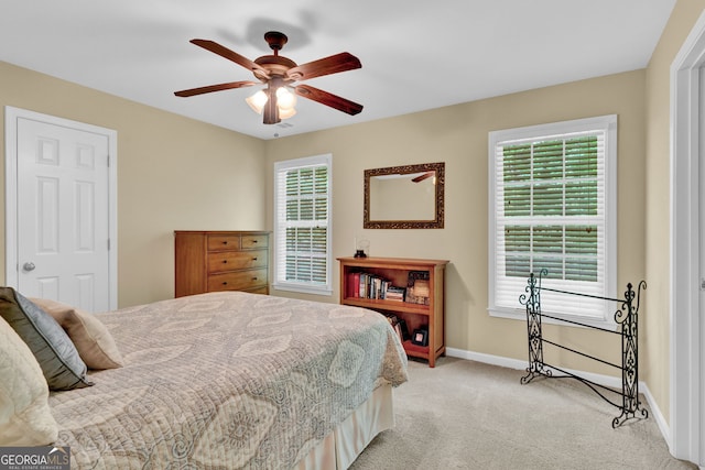 1477 Edenham Ln, Cumming, GA 30041 - bedroom featuring light colored carpet, multiple windows, and ceiling fan
