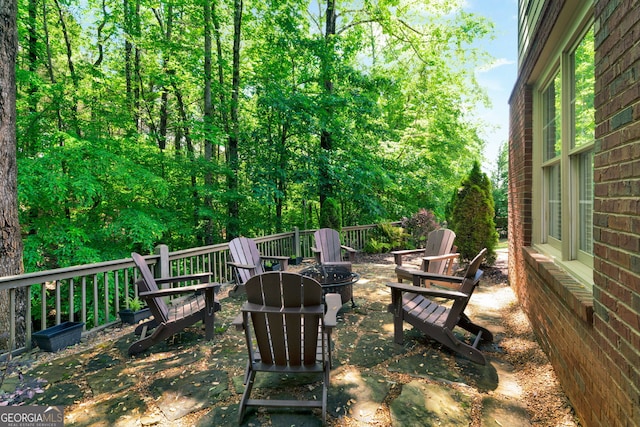 view of yard with an outdoor fire pit