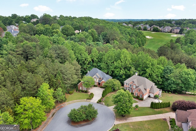 aerial perspective of suburban area featuring a golf course