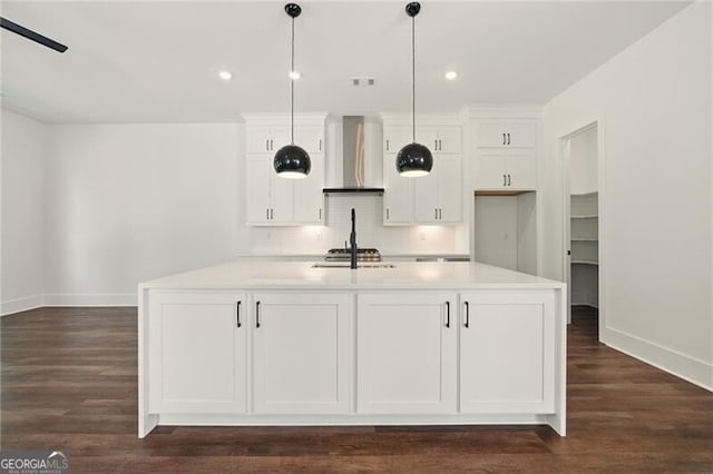 2150 Tidwell Ln Unit 5, Atlanta, GA 30318 - kitchen featuring wall chimney range hood, baseboards, white cabinetry, tasteful backsplash, and light countertops