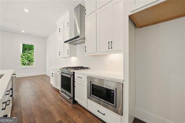2150 Tidwell Ln Unit 5, Atlanta, GA 30318 - kitchen featuring stainless steel appliances, wall chimney exhaust hood, light countertops, dark wood finished floors, and recessed lighting