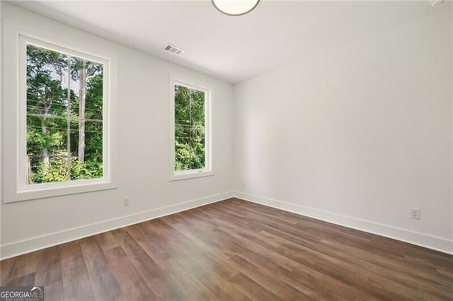 2150 Tidwell Ln Unit 5, Atlanta, GA 30318 - unfurnished room with healthy amount of natural light, baseboards, and dark wood-style floors
