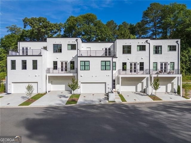 2150 Tidwell Ln Unit 5, Atlanta, GA 30318 - view of property featuring an attached garage and concrete driveway