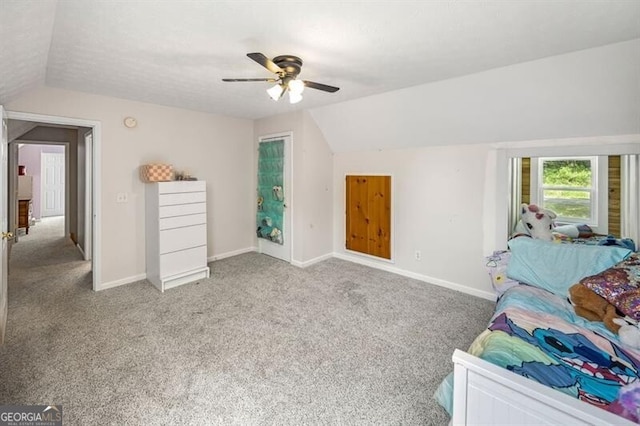 bedroom with vaulted ceiling, carpet, baseboards, and ceiling fan
