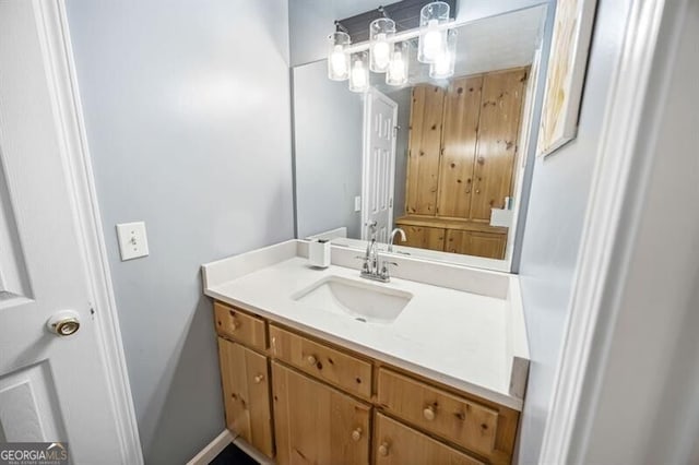 bathroom featuring vanity and baseboards