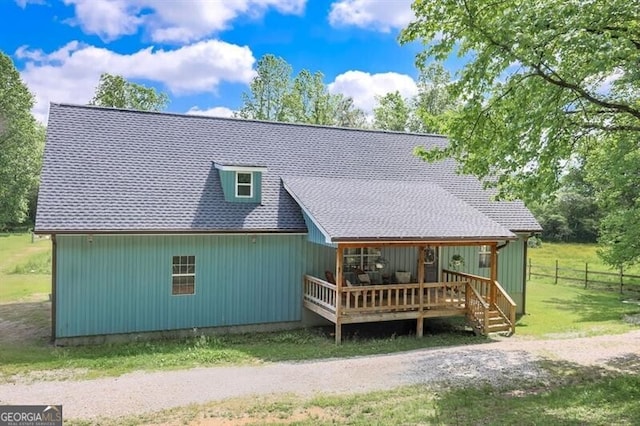 back of property with a deck