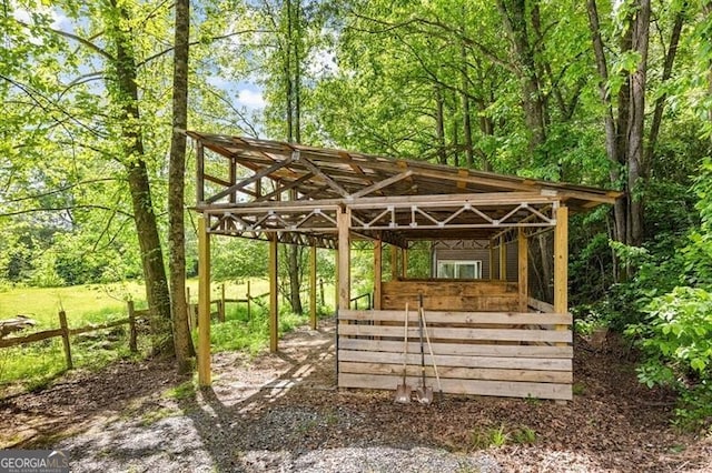 view of community with an exterior structure, an outbuilding, and a carport