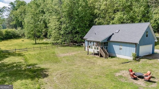 view from above of property with a forest