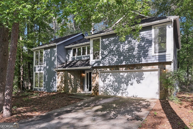 5362 Kelleys Mill Cir, Stone Mountain, GA 30088 - view of front of home with driveway and an attached garage