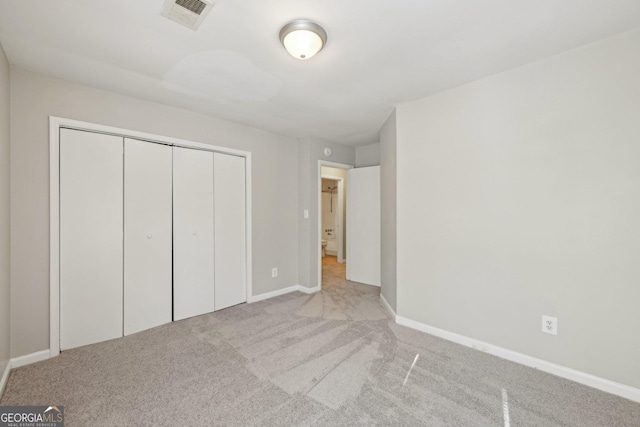 5362 Kelleys Mill Cir, Stone Mountain, GA 30088 - unfurnished bedroom with carpet flooring, baseboards, and a closet