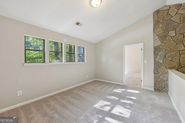 5362 Kelleys Mill Cir, Stone Mountain, GA 30088 - carpeted empty room with vaulted ceiling and baseboards