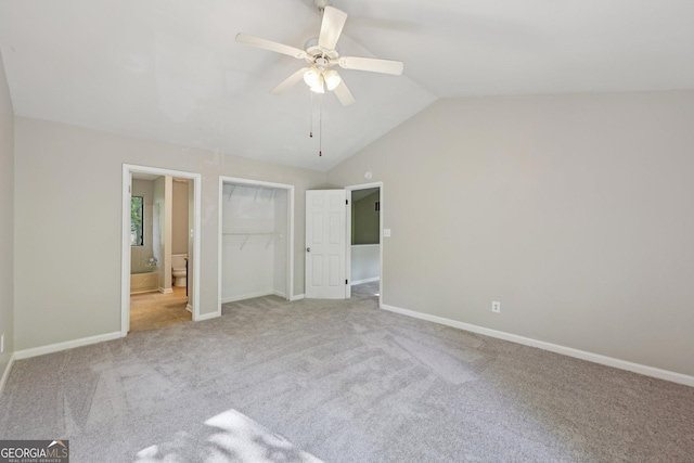 5362 Kelleys Mill Cir, Stone Mountain, GA 30088 - unfurnished bedroom featuring carpet, lofted ceiling, baseboards, ensuite bath, and a closet