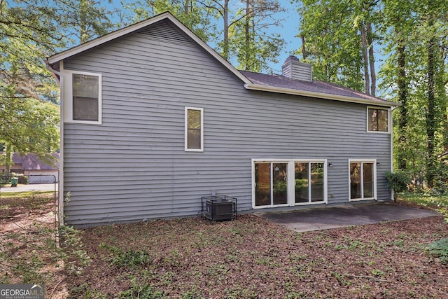 5362 Kelleys Mill Cir, Stone Mountain, GA 30088 - rear view of property featuring a patio area and a chimney