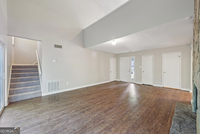 5362 Kelleys Mill Cir, Stone Mountain, GA 30088 - unfurnished living room featuring wood finished floors, stairway, and baseboards