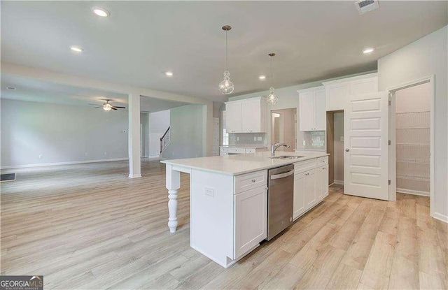 160 Cooper Cv W Lot 64, Fayetteville, GA 30215 - kitchen featuring dishwasher, light wood-style floors, open floor plan, white cabinets, and recessed lighting