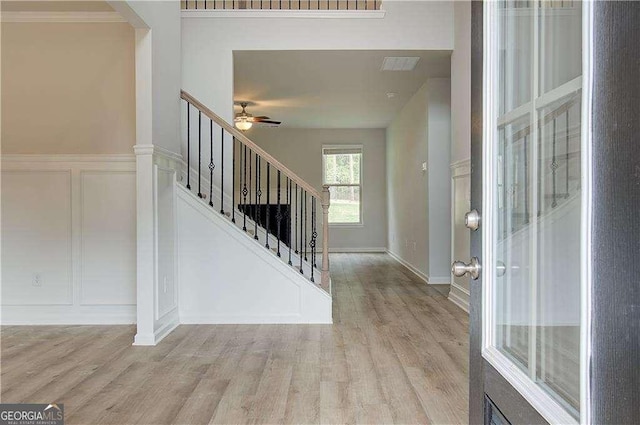 160 Cooper Cv W Lot 64, Fayetteville, GA 30215 - entrance foyer featuring light wood-style floors, a decorative wall, stairway, and a ceiling fan