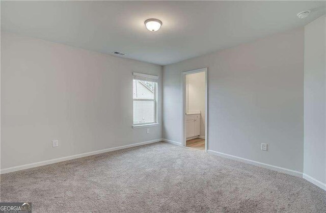 160 Cooper Cv W Lot 64, Fayetteville, GA 30215 - unfurnished room with light carpet and a smoke detector