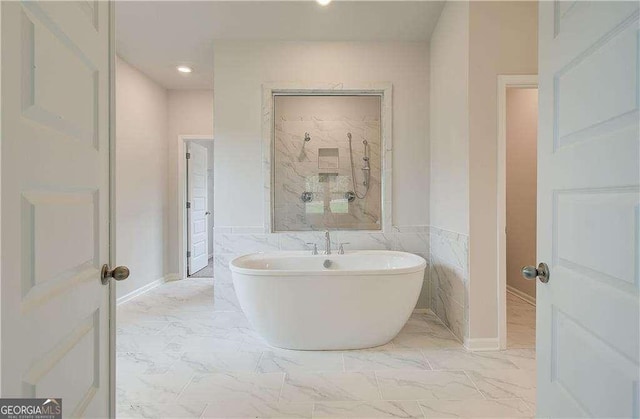 160 Cooper Cv W Lot 64, Fayetteville, GA 30215 - bathroom featuring marble look tile flooring, a soaking tub, and recessed lighting